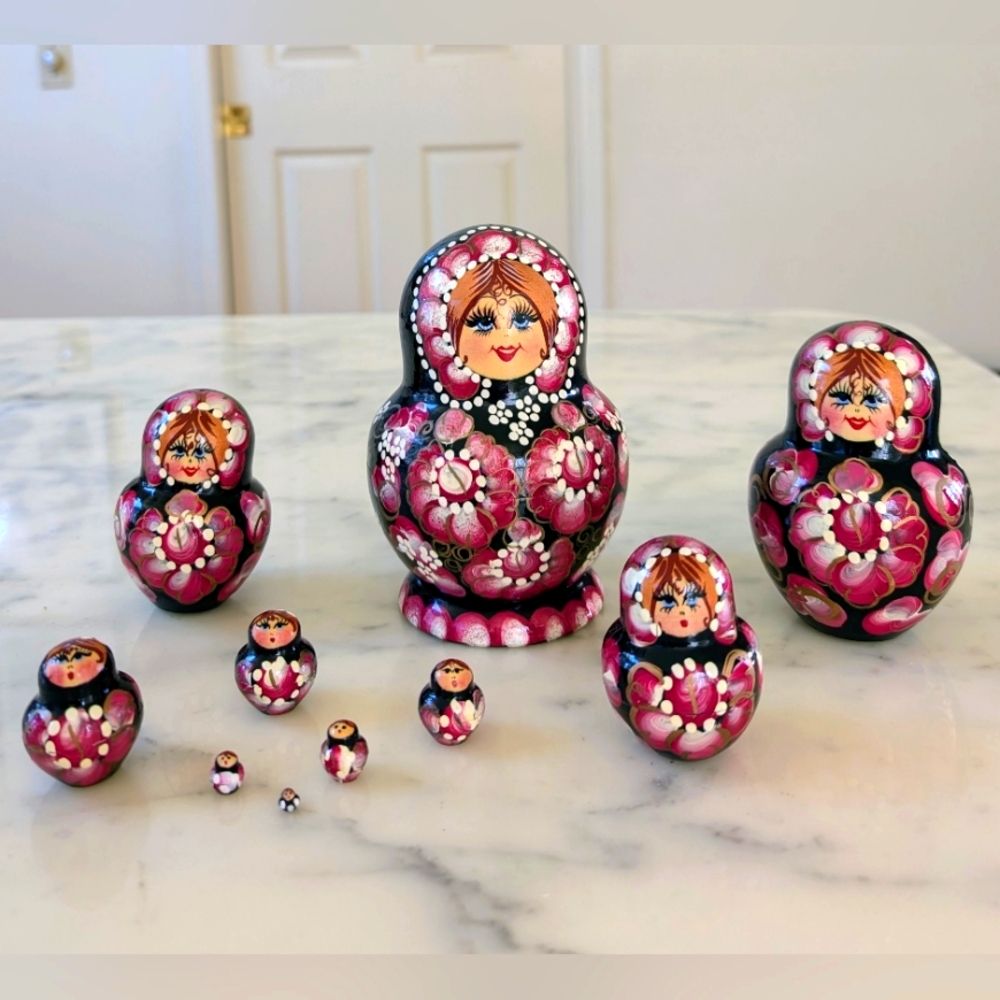 NWT. Beautiful set of Pink Russian Matryoshka Dolls with Colorful Floral Designs